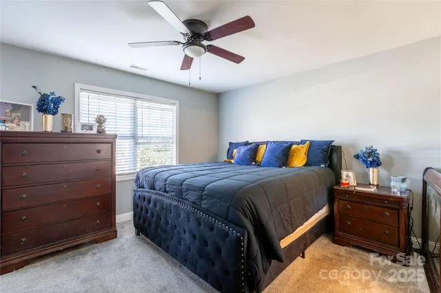 a bedroom with a bed and dresser