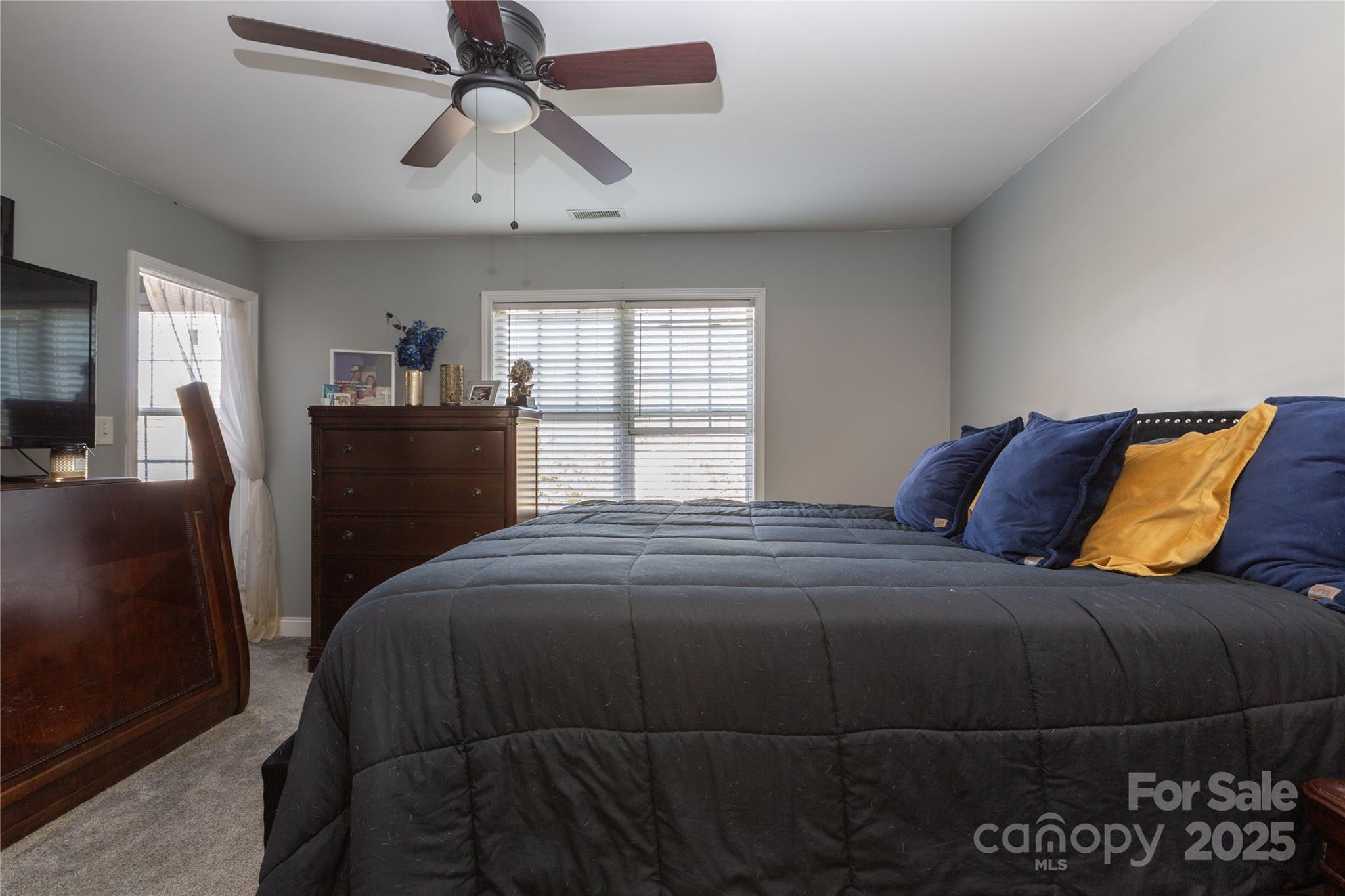 505 Coffeetree Lane Stanley, NC 28164 - Photo 16 of 37 a bedroom with a bed and dresser with mirror