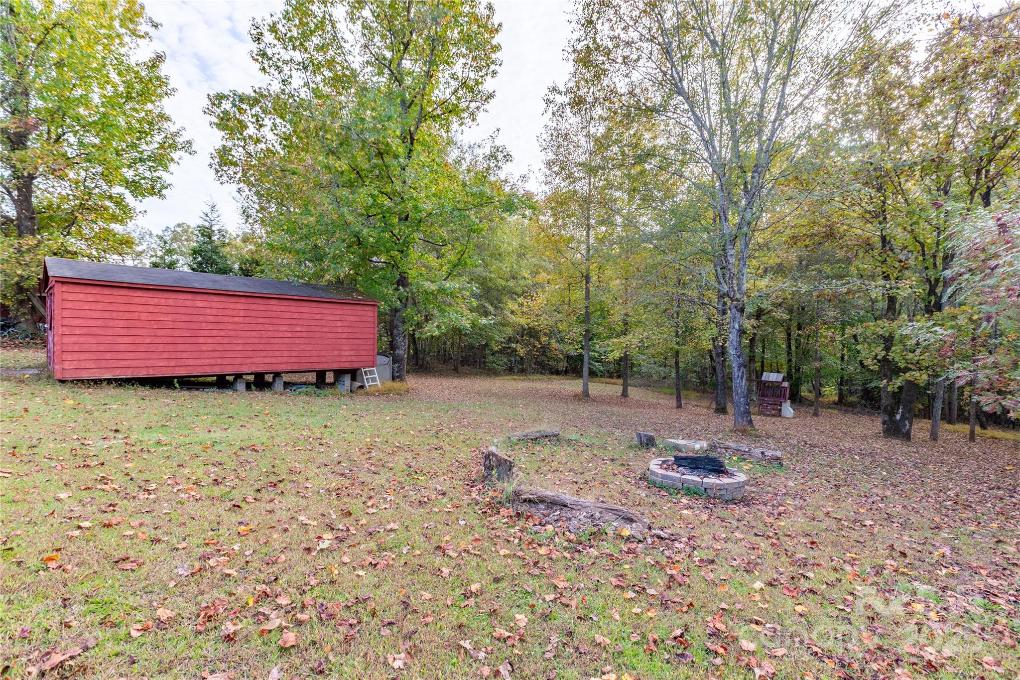 505 Coffeetree Lane Stanley, NC 28164 - Photo 30 of 37 a view of a backyard with large trees