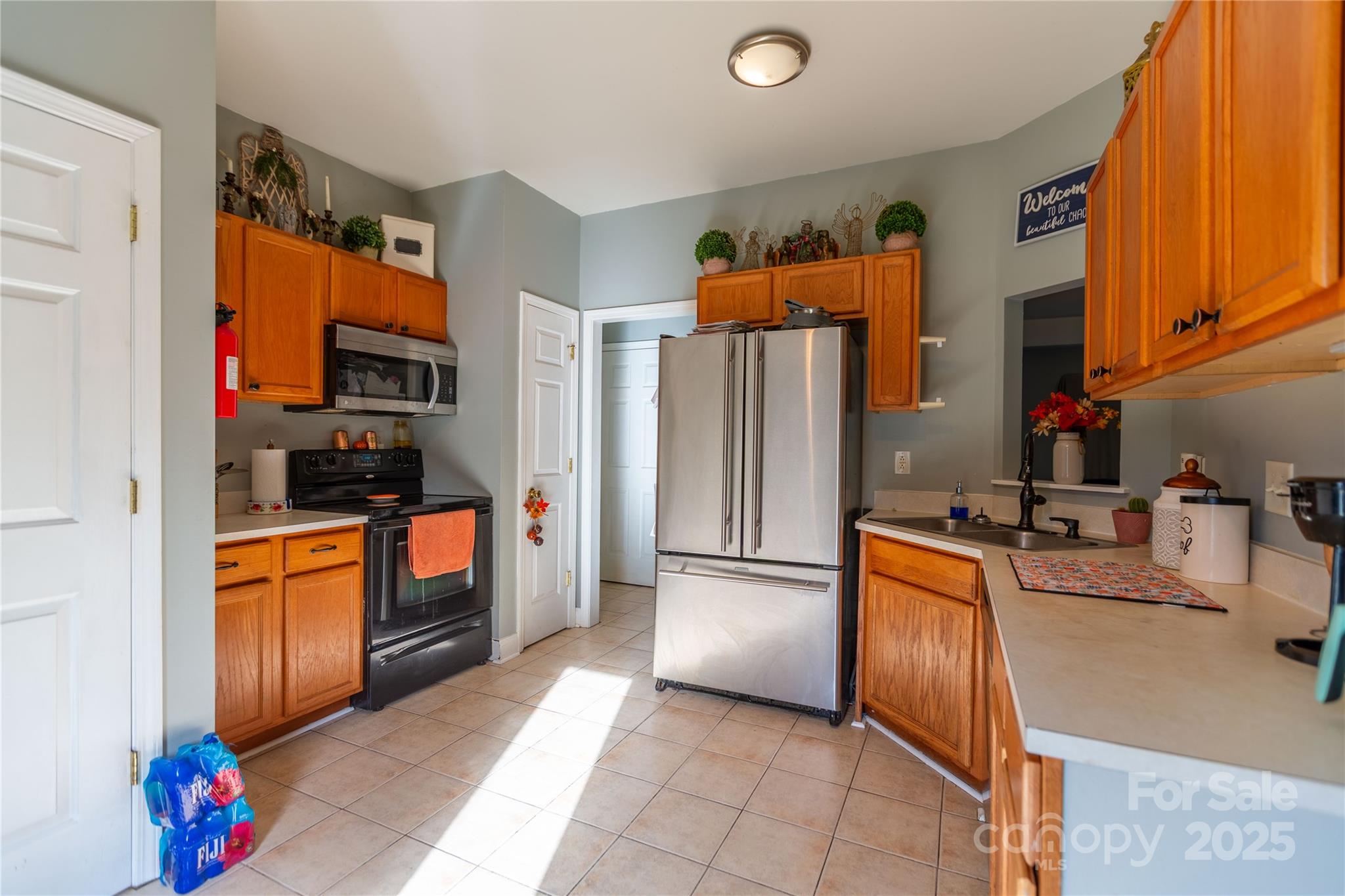 505 Coffeetree Lane Stanley, NC 28164 - Photo 9 of 37 a kitchen with stainless steel appliances granite countertop a refrigerator and a sink