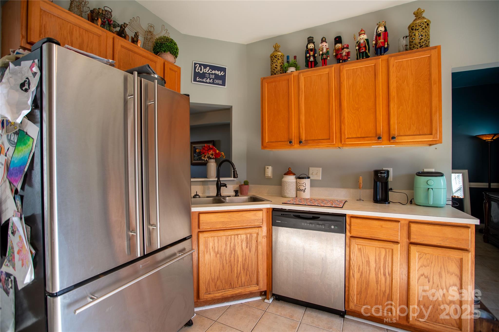 505 Coffeetree Lane Stanley, NC 28164 - Photo 10 of 37 a kitchen with stainless steel appliances a refrigerator sink and cabinets