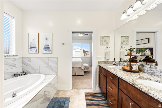 357 East Main Street Enterprise, UT 84725 - Photo 30 of 71 Full bathroom with double vanity, a garden tub, connected bathroom, and ceiling fan