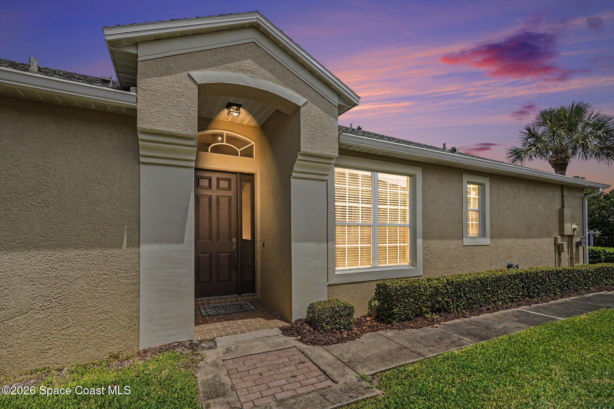 284 Intrepid Way Indialantic, FL 32903 - Photo 2 of 36 a front view of a house with garden