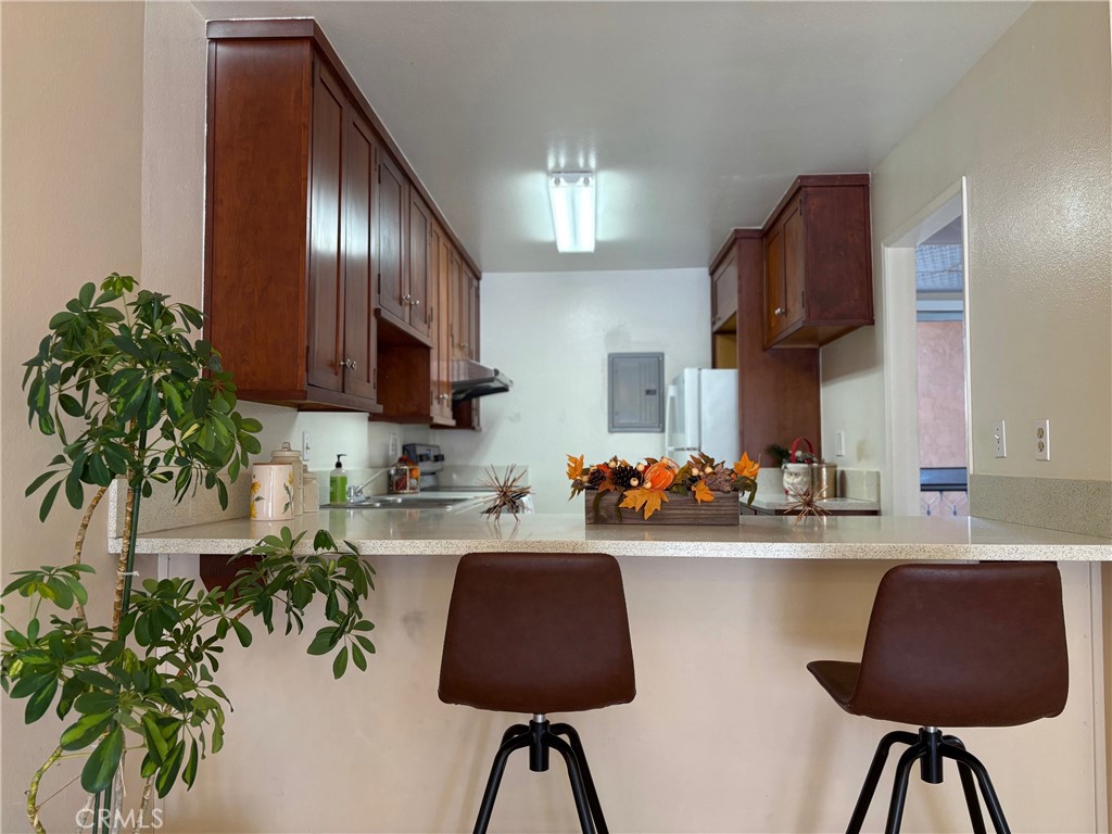 1126 Fairview Avenue, Unit 210 Arcadia, CA 91007 - Photo 4 of 16 a kitchen with granite countertop a sink stainless steel appliances and cabinets