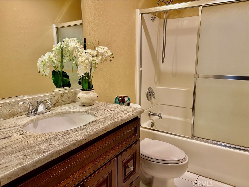 1126 Fairview Avenue, Unit 210 Arcadia, CA 91007 - Photo 9 of 16 a bathroom with a granite countertop sink toilet and shower