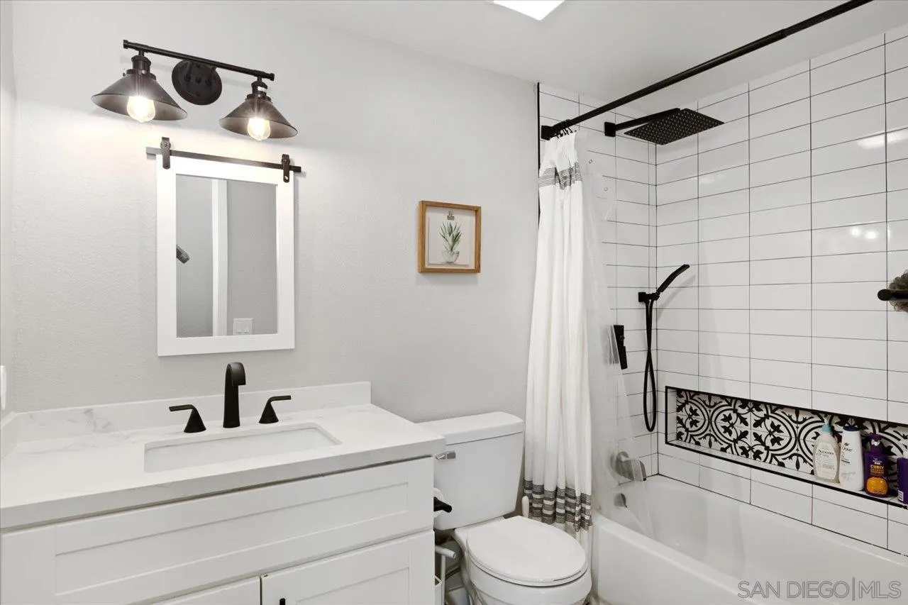 562 Tag Lane Ramona, CA 92065 - Photo 15 of 30 a bathroom with a sink toilet a mirror and shower