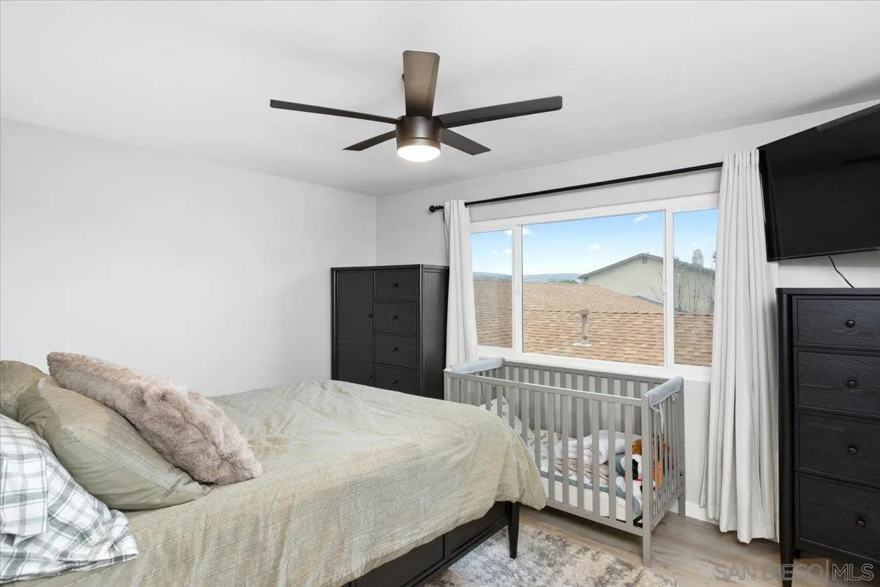 562 Tag Lane Ramona, CA 92065 - Photo 17 of 30 a bedroom with a bed and a television