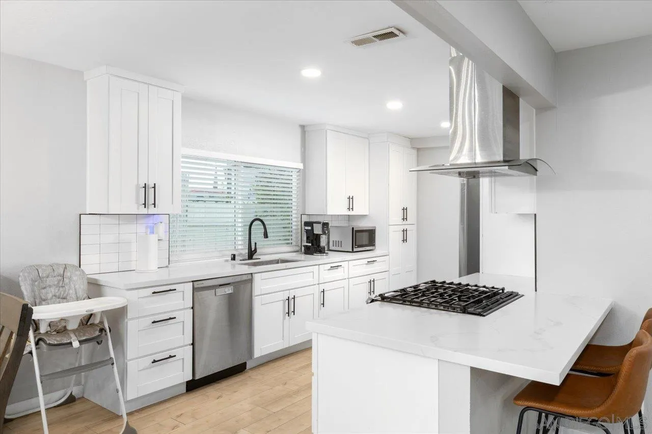 562 Tag Lane Ramona, CA 92065 - Photo 9 of 30 a kitchen that has a lot of cabinets in it and appliances