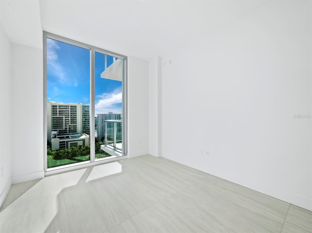 301 Quay Commons, Unit 1409 Sarasota, FL 34236 - Photo 14 of 45 a view of an empty room with glass door