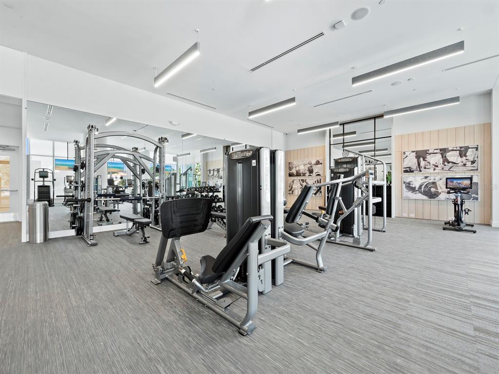 301 Quay Commons, Unit 1409 Sarasota, FL 34236 - Photo 24 of 45 a view of a room with gym equipment
