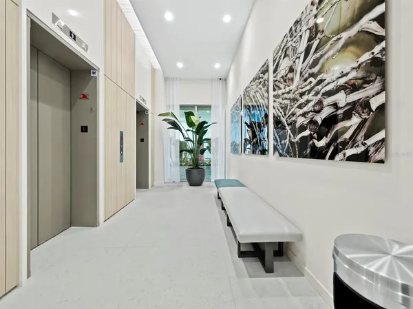 a view of a hallway with seating area