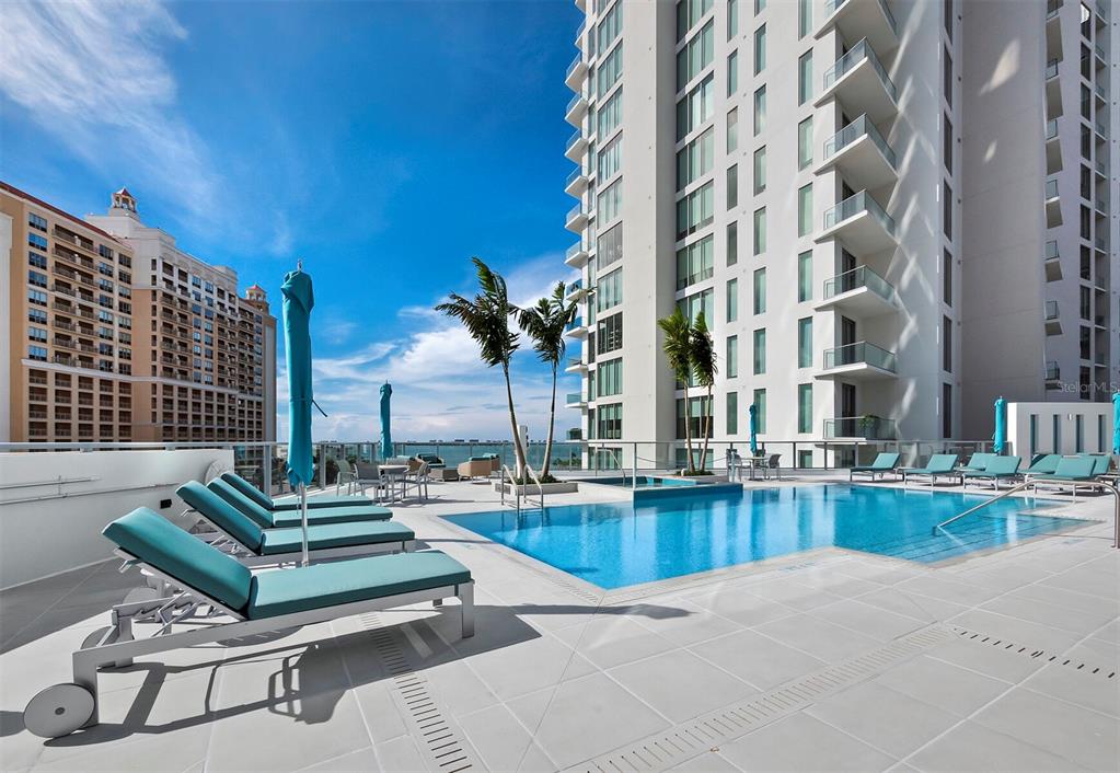 301 Quay Commons, Unit 1409 Sarasota, FL 34236 - Photo 32 of 45 a view of pool with outdoor seating