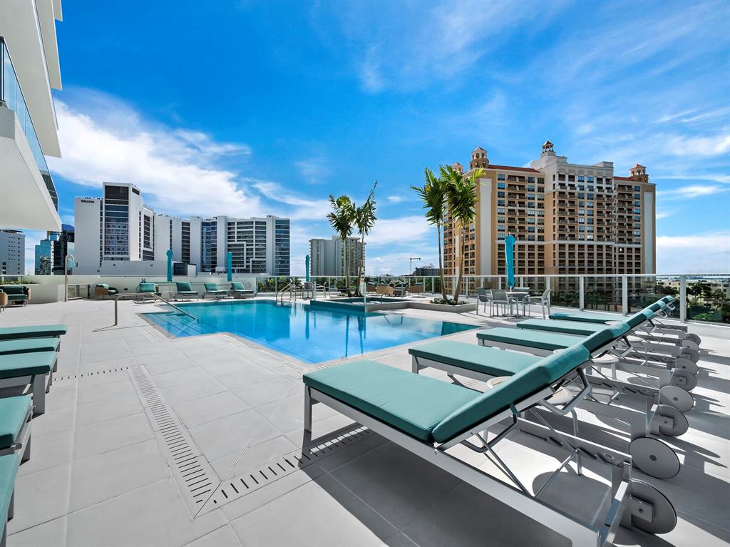 301 Quay Commons, Unit 1409 Sarasota, FL 34236 - Photo 33 of 45 a view of a patio with swimming pool