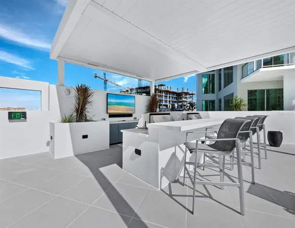 a living room with lots of furniture and appliances