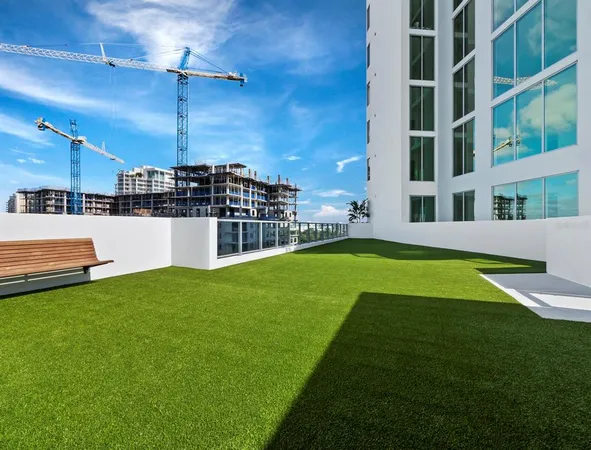 a swimming pool with some trees in the background