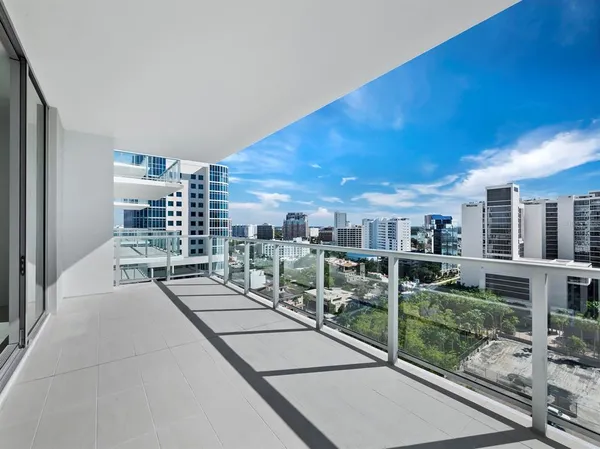 a view of a patio with a table and chairs