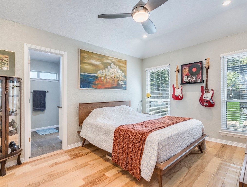 1008 Riviera Drive Cedar Park, TX 78613 - Photo 13 of 32 a bedroom with a bed and a painting on the wall