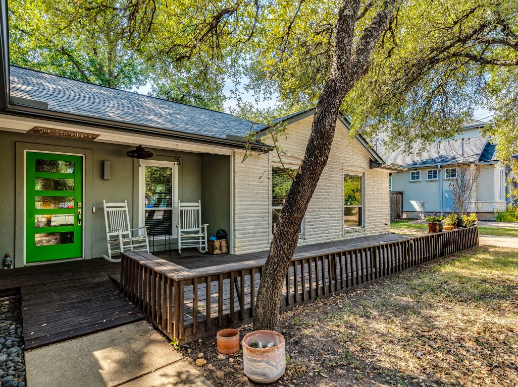 1008 Riviera Drive Cedar Park, TX 78613 - Photo 2 of 32 a view of a deck with two couches and wooden fence with wooden fence