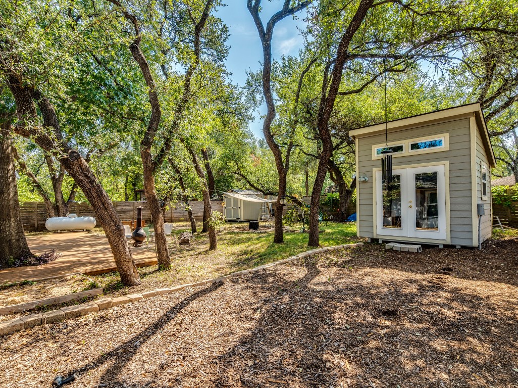 1008 Riviera Drive Cedar Park, TX 78613 - Photo 23 of 32 a view of a yard with plants and trees