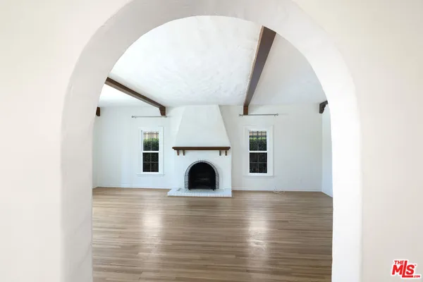a view of living room with furniture and fireplace