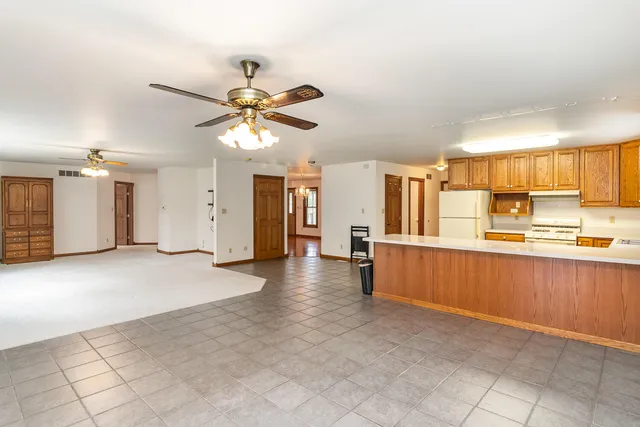 a view of a kitchen with a sink and a window