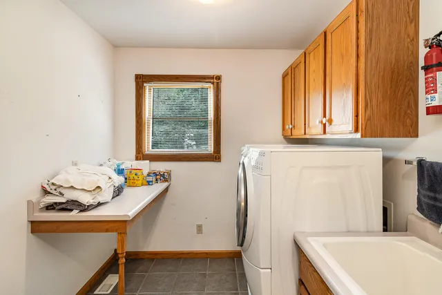 a bathroom with a sink and a window