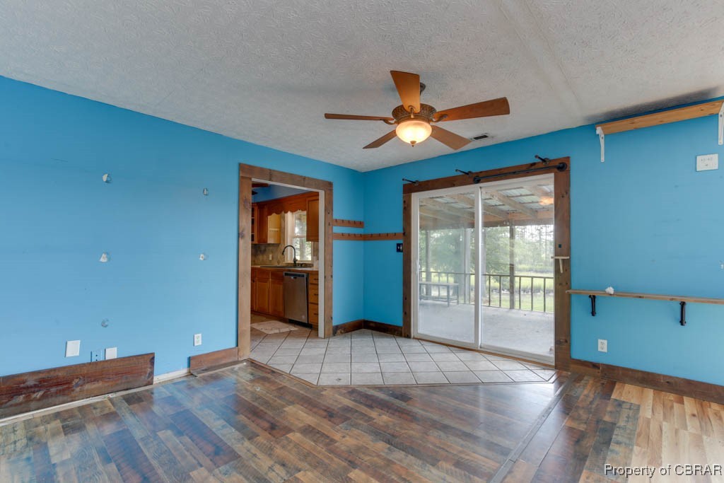 2584 Starvation Road Gloucester, VA 23061 - Photo 13 of 38 dining area steps out into the screened in porch- Great views!