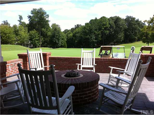 800 West Savannah Ridge Road, Unit 110 Holly Springs, NC 27540 - Photo 12 of 15 A terrific backdrop... Outdoor dining available overlooking the putting green. Or just cozy up to the fire on a chilly afternoon...