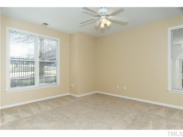 Corner unit allows natural light to spill inside. Ceiling fan provides comfort.