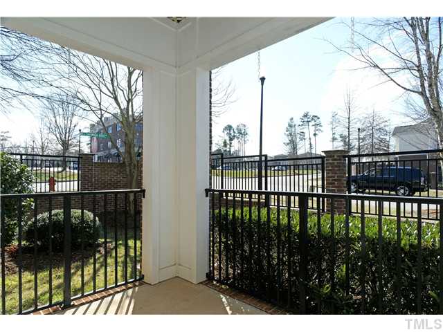 800 West Savannah Ridge Road, Unit 110 Holly Springs, NC 27540 - Photo 9 of 15 Private porch overlooks the quiet street and is perfect for lazy afternoons.