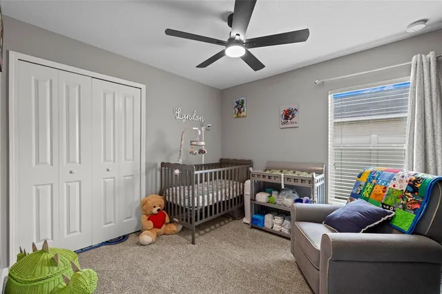 a bedroom with furniture and a window
