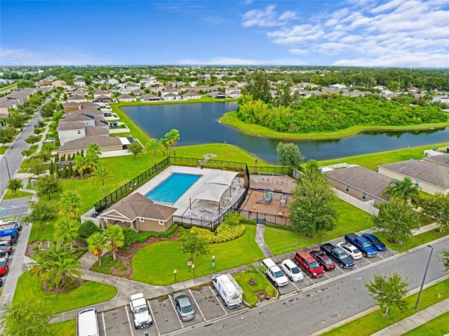 an aerial view of a pool patio swimming pool and outdoor seating