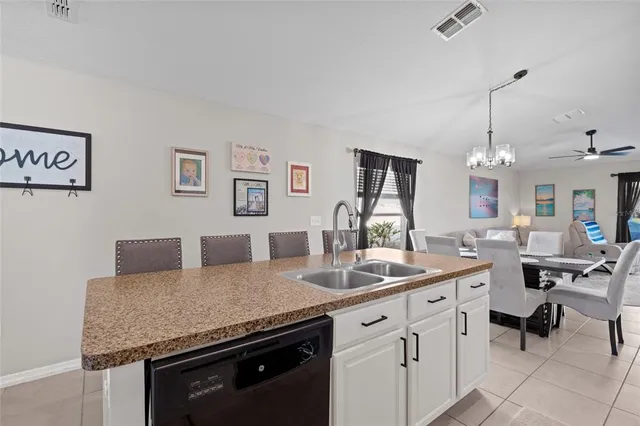 a kitchen with a granite countertop sink and a granite counter tops