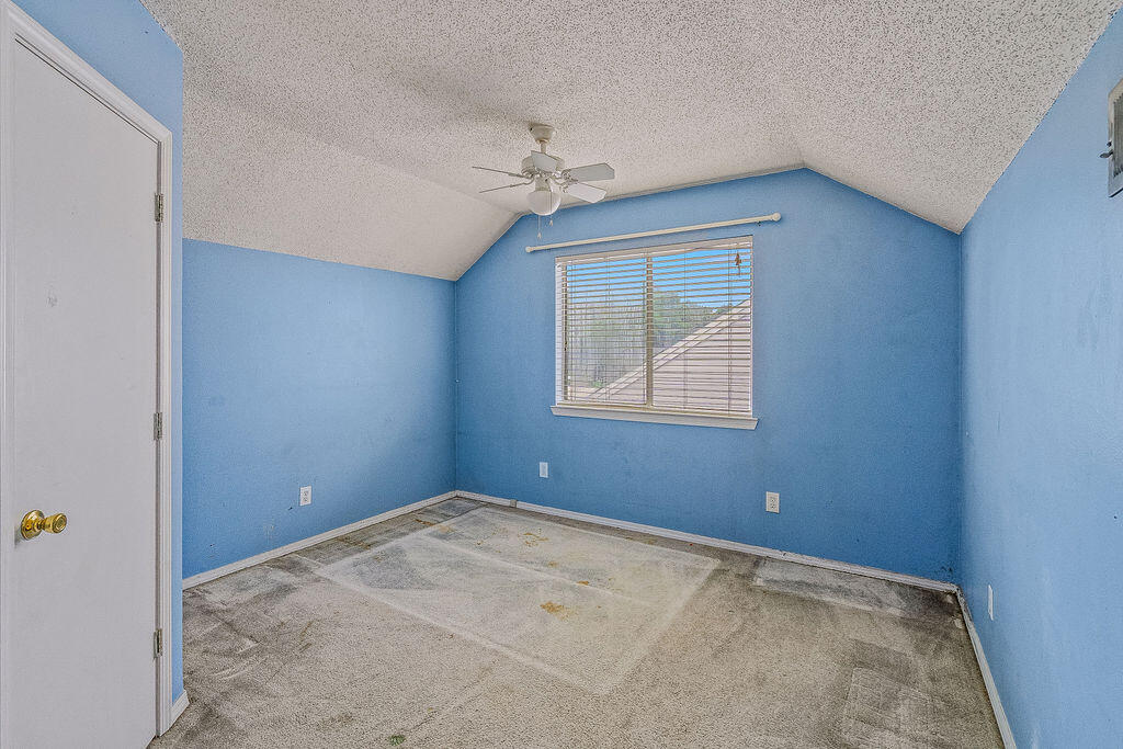 53 4th Street Shalimar, FL 32579 - Photo 21 of 47 an empty room with windows and fan