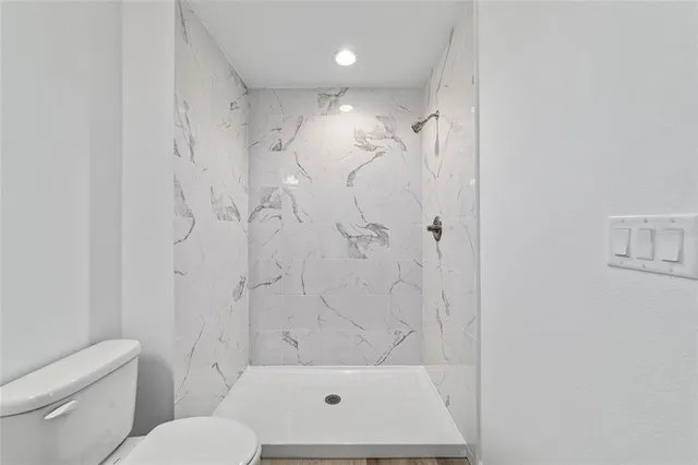 a bathroom with a bathtub and a shower