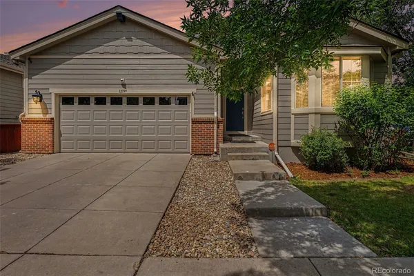 a front view of a house with yard