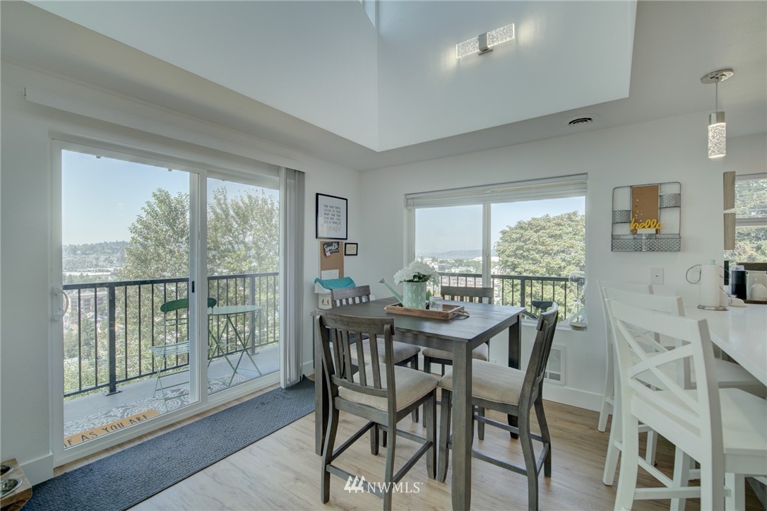 512 Mill Avenue South Renton, WA 98057 - Photo 8 of 19 a view of a dining room with furniture and a table and chairs