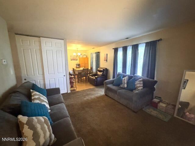1557 Delucchi Lane, Unit G Reno, NV 89502 - Photo 2 of 8 a living room with furniture and large windows