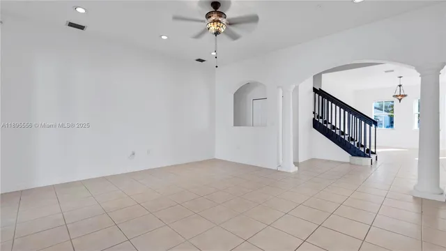 a kitchen with stainless steel appliances granite countertop a refrigerator stove a sink and dishwasher