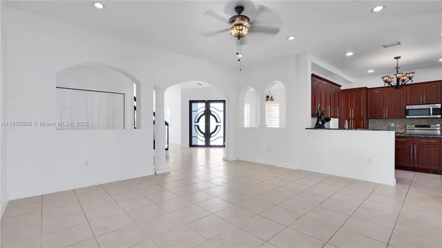 a kitchen with granite countertop cabinets stainless steel appliances and a counter space