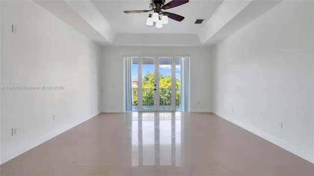 a bathroom with a tub a double vanity sink and mirror