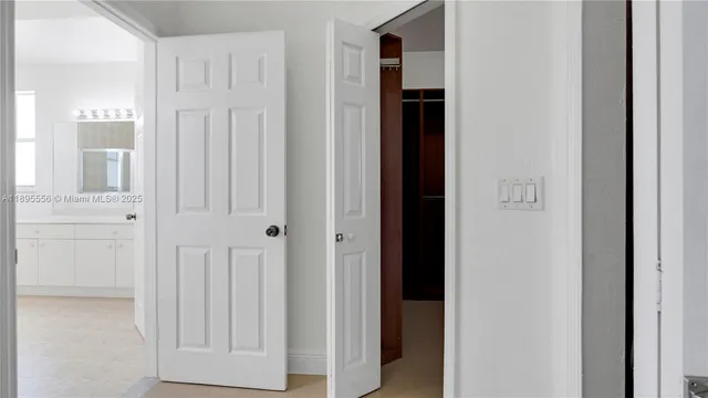 a white toilet sitting next to a bathroom sink