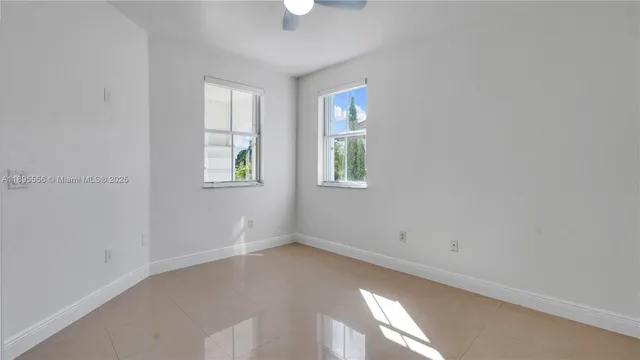 a bathroom with a bath tub with a shower