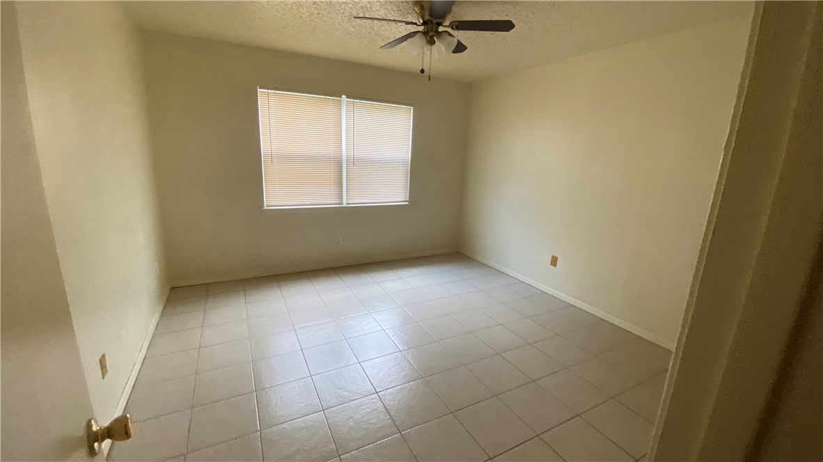 1908 West Loop, Unit A Austin, TX 78758 - Photo 8 of 13 a view of an empty room with a window
