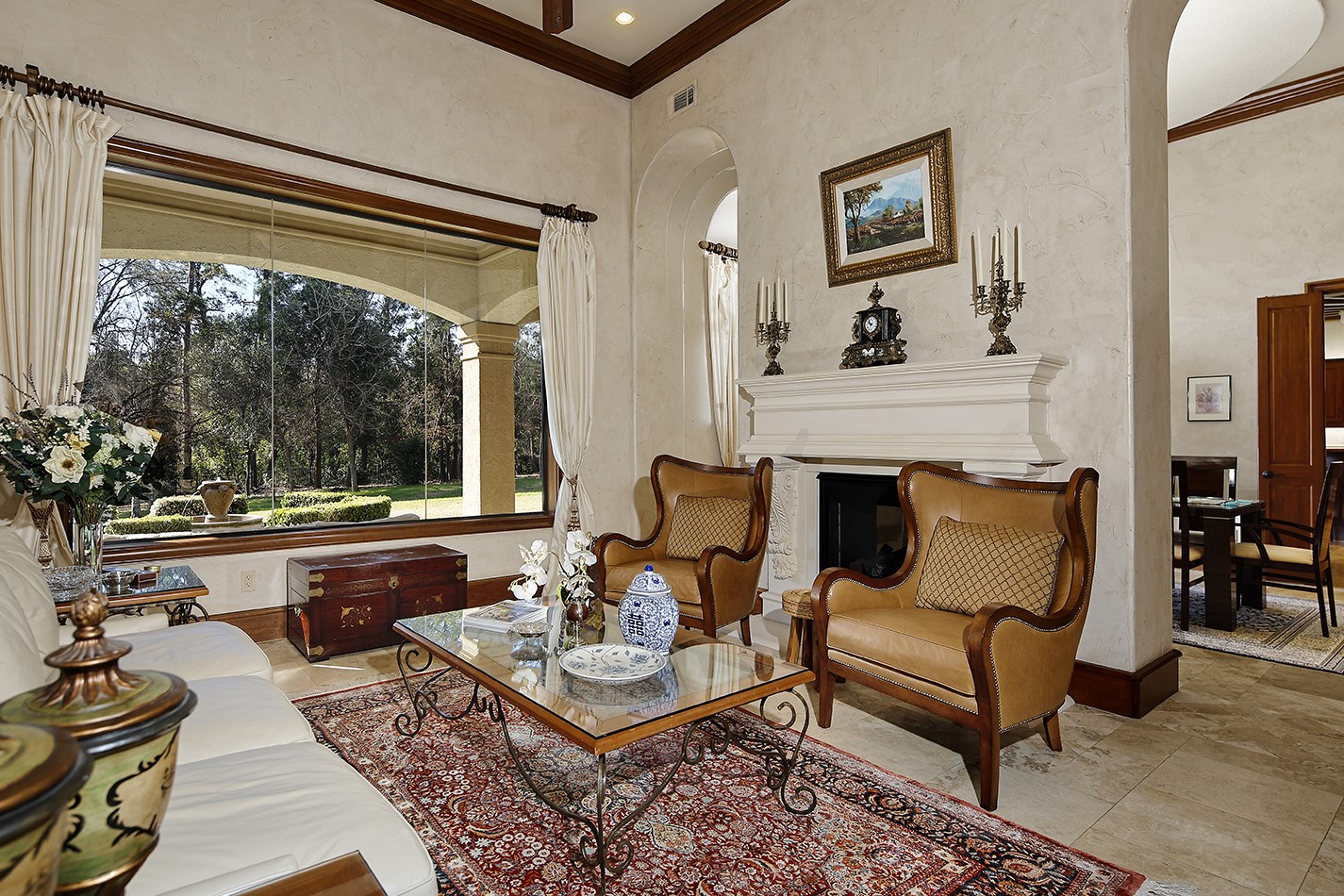 134 South Tranquil Path The Woodlands, TX 77380 - Photo 13 of 49 Formal living shares fireplace with adjoining formal dining.