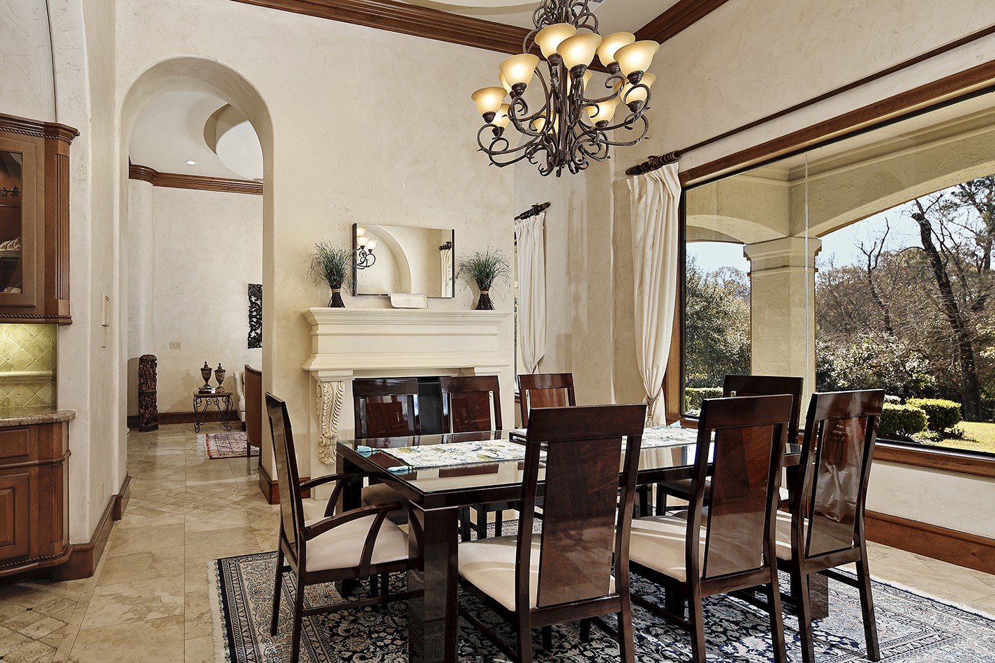 134 South Tranquil Path The Woodlands, TX 77380 - Photo 15 of 49 Formal dining shares fireplace with formal living.