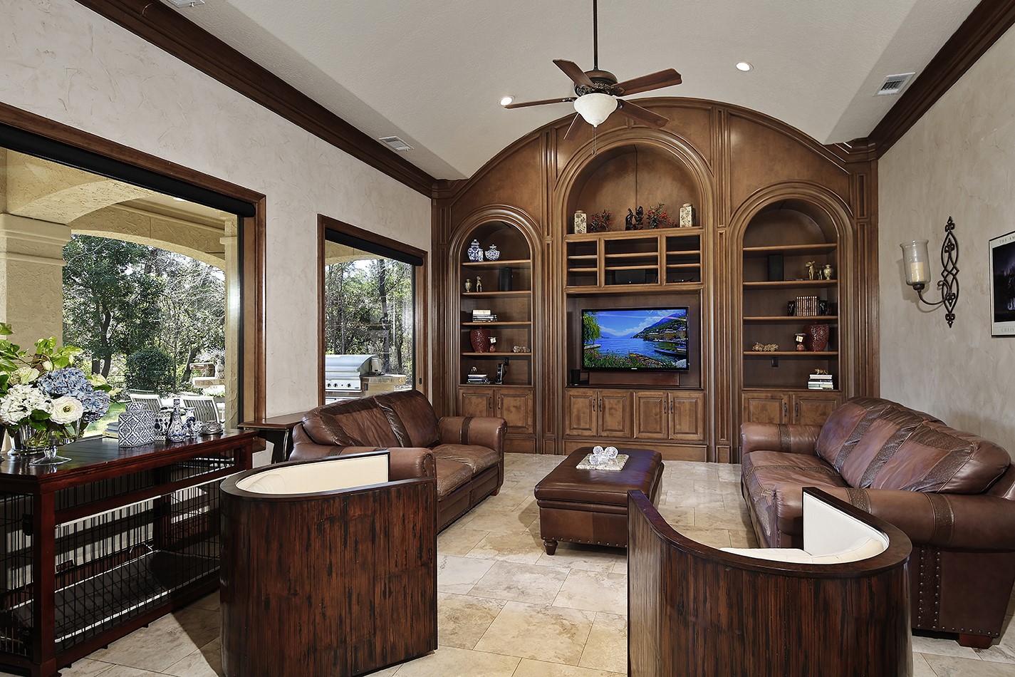 134 South Tranquil Path The Woodlands, TX 77380 - Photo 25 of 49 Gorgeous woodwork and plate glass windows in family room with wall of built-ins.