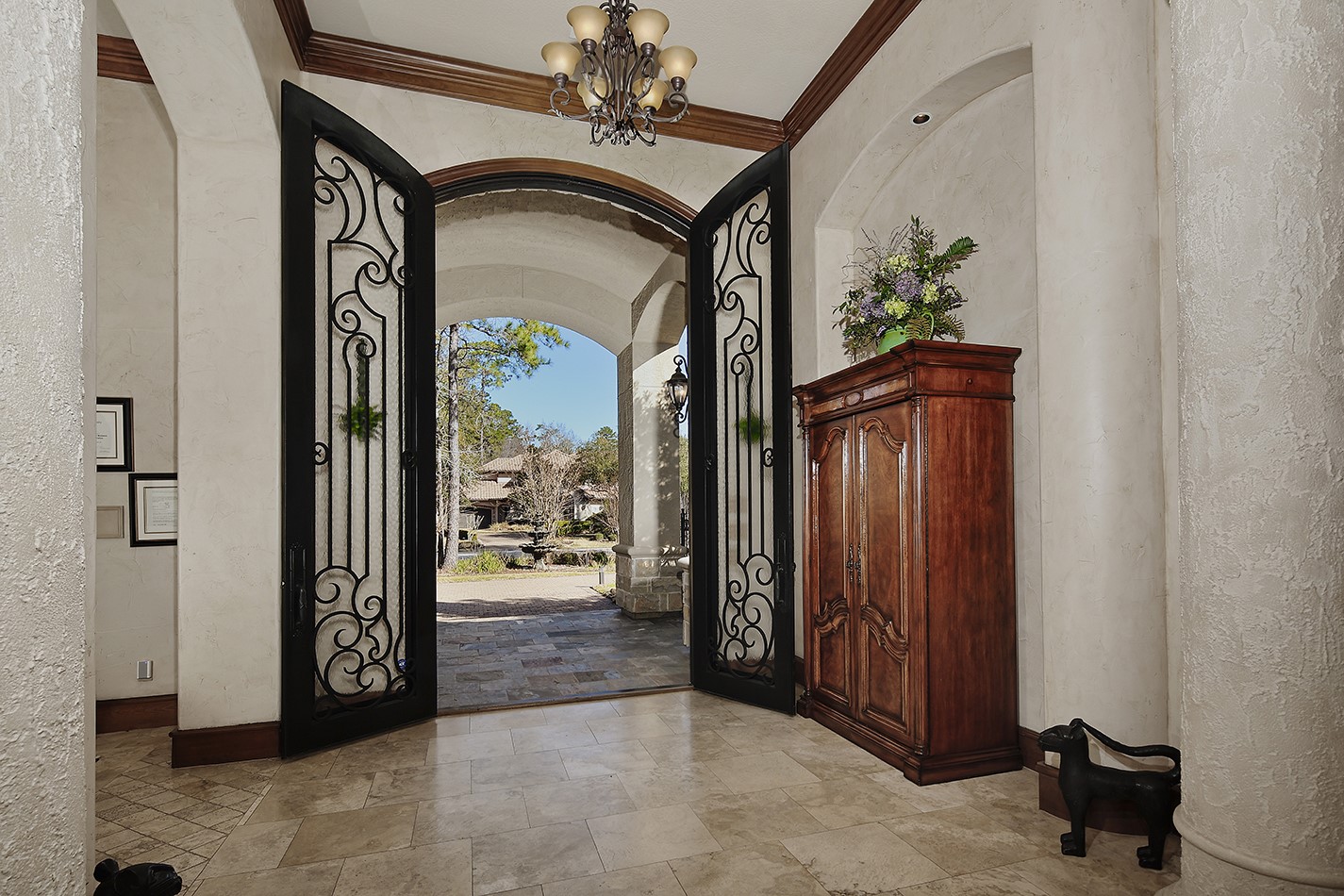 134 South Tranquil Path The Woodlands, TX 77380 - Photo 9 of 49 Gorgeous iron double Canterra entry door.
