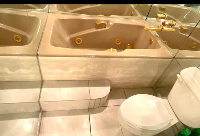 2520 Presidential Way, Unit 205 West Palm Beach, FL 33401 - Photo 13 of 22 a bathroom with a toilet