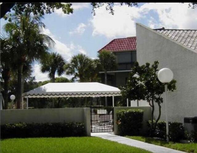 2520 Presidential Way, Unit 205 West Palm Beach, FL 33401 - Photo 19 of 22 a view of a house with a sink